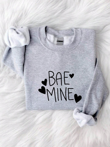 Spread the love this Valentine's Day with our "Love is in the Air" sweatshirt! Stay cozy and stylish while declaring your love. Be the perfect "mine" for your special someone with this quirky and fun sweatshirt. Don't wait any longer, grab one now! (Only 40 words, darling!)