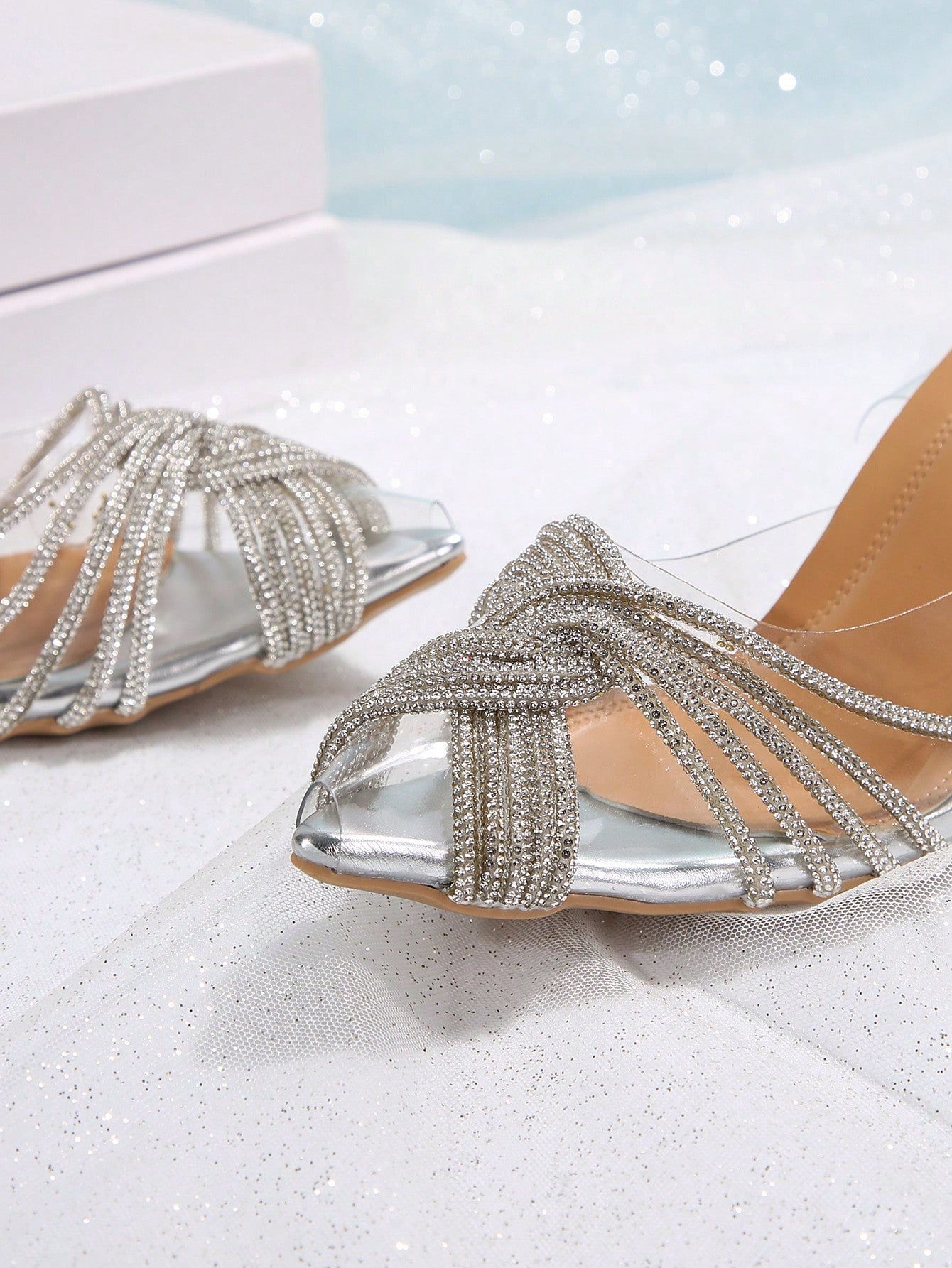 Get ready to sparkle and shine this summer with our Luminous Elegance sandals. Adorned with dazzling rhinestones and featuring a transparent high heel, these sandals add a touch of fairy-tale magic to any outfit. Look and feel like a fairy princess wherever you go!