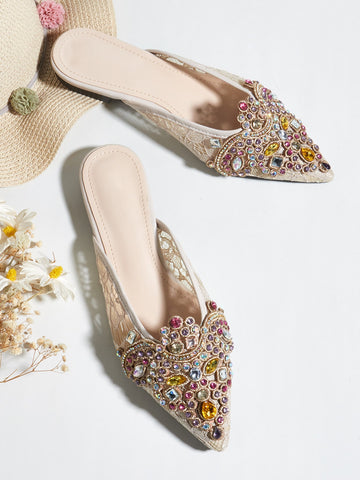 Elevate your evening ensemble with these sophisticated rhinestone flat mules, designed for the discerning woman who refuses to compromise on style or comfort. Featuring dazzling crystal embellishments that catch the light beautifully, these mules transition seamlessly from autumn gatherings to winter celebrations. The flat sole provides all-day wearability without sacrificing elegance, making them an ideal choice for parties, dinners, and special occasions. Crafted with attention to detail, these versatile 