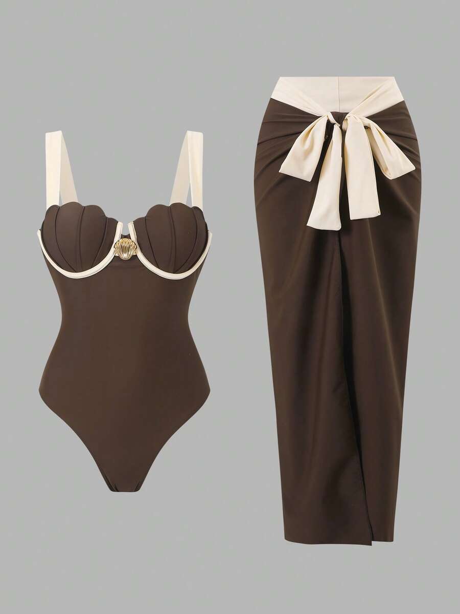 Elevate your beach days with this stunning vintage-inspired 2-piece set. Featuring delicate shell embellishments and a flowing wrap skirt, this ensemble combines timeless elegance with modern comfort. The coordinated top and skirt create a sophisticated silhouette perfect for seaside getaways, resort wear, or poolside lounging. Crafted with attention to detail, this luxury piece brings a touch of coastal glamour to your vacation wardrobe.