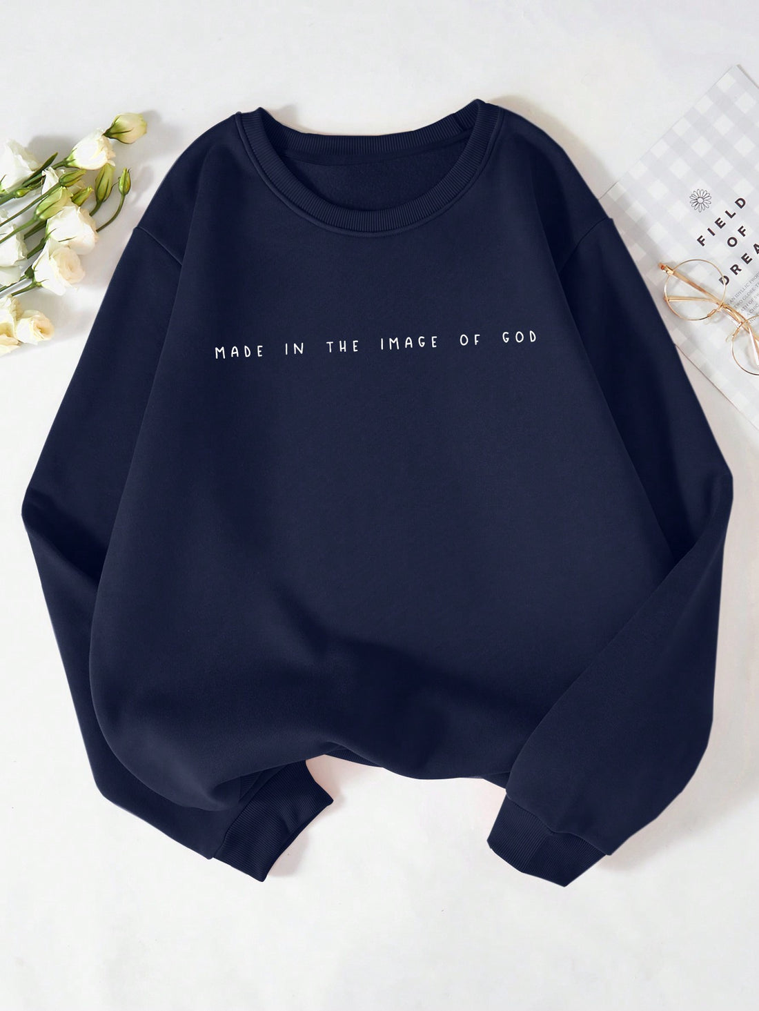 Wrap yourself in inspiration with our Made in the Image of God fleece sweatshirt. Emblazoned with bold, uplifting lettering, this cozy sweatshirt reminds you that you are a unique creation with a divine purpose. Made with soft, high-quality fleece for maximum comfort. Let faith and fashion come together with this one-of-a-kind sweatshirt. Amen.