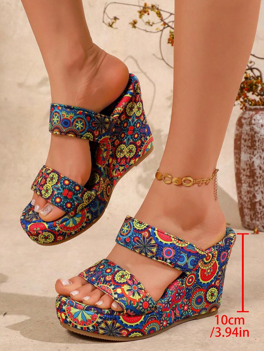 Boho wedge sandals side view with 10cm heel height label and bright mandala fabric print