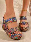 Mandala print wedge slide sandals on foot front view with blue multicolor straps and open toe