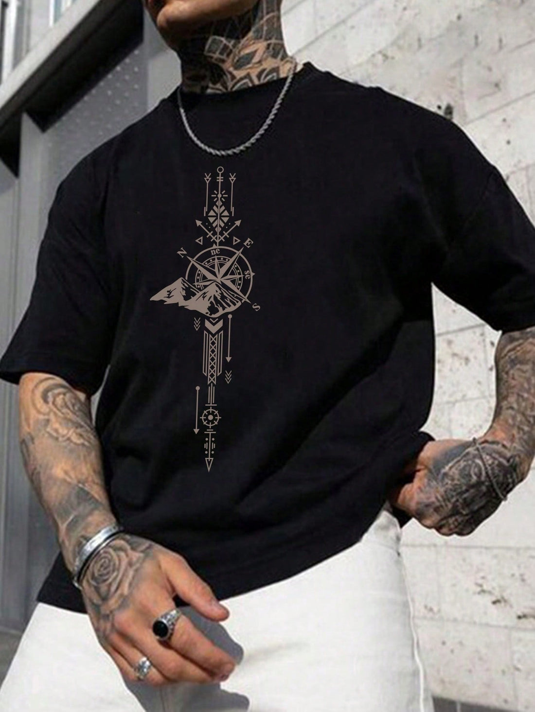 Adventure awaits with this casual and quirky Men's Compass Graphic Tee! Featuring a unique and playful compass design, this tee is perfect for those with a fun and adventurous spirit. Made for comfort and style, it's the ultimate addition to any casual outfit.