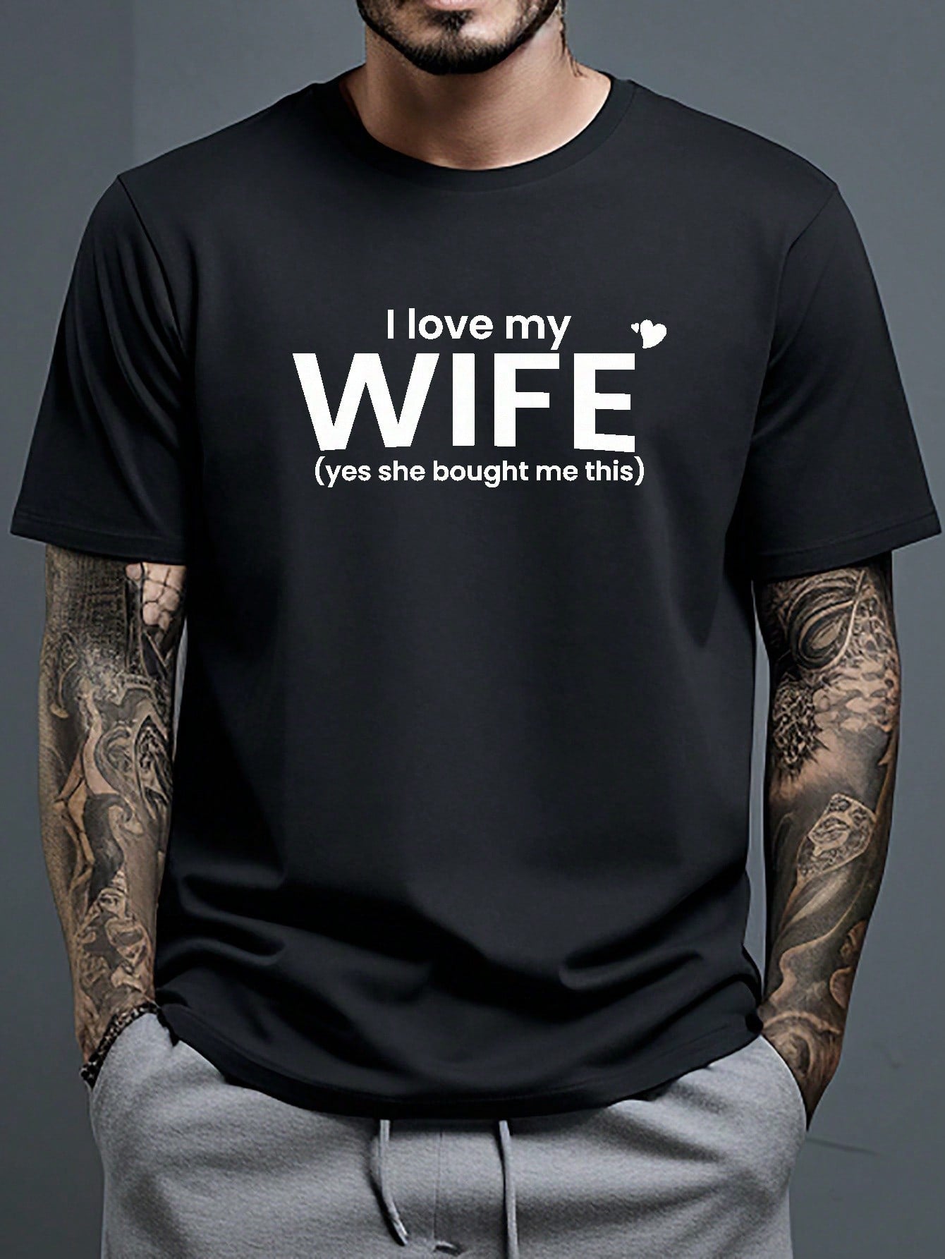 Show your love with a playful twist in this men's round neck t-shirt featuring a bold "Love My Wife" graphic. Crafted for comfort and style, it’s perfect for year-round wear, whether you're out and about or relaxing at home. Soft fabric and a classic fit make it an easy favorite for everyday fun.