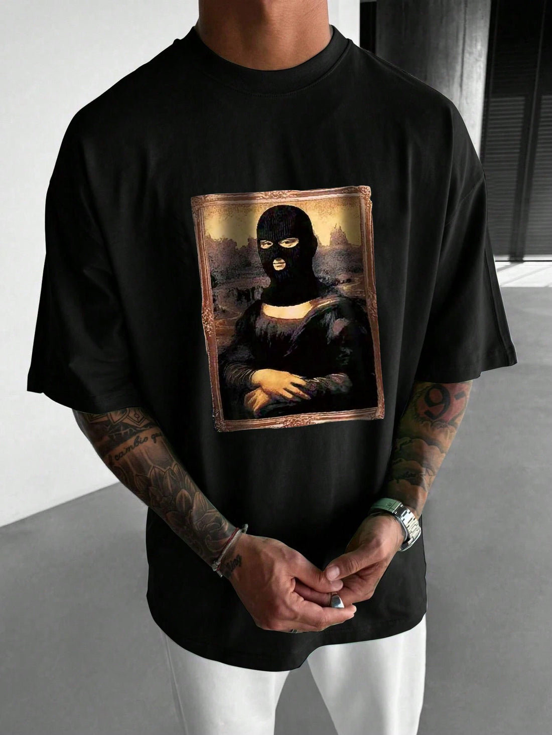 This men's t-shirt features a modern twist on the classic masterpiece, the Mona Lisa. With a unique print, this shirt adds an artistic flair to any outfit. Made with high-quality materials for lasting comfort. Elevate your style with this one-of-a-kind t-shirt.