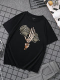 This men's tee features a spooky and unique design of a skeleton hand holding money, perfect for Halloween. Made with high-quality materials, it is comfortable and stylish. Add a touch of novelty to your wardrobe while showing off your love for Halloween.