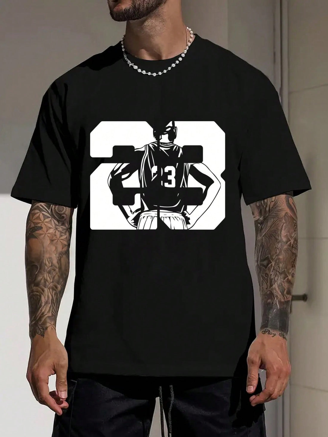 This Men's Summer Basketball Player Graphic Tee is perfect for any basketball fan or player. With its bold graphic of number 23, it's sure to turn heads. Made with a comfortable and breathable fabric, this tee will keep you cool on and off the court.