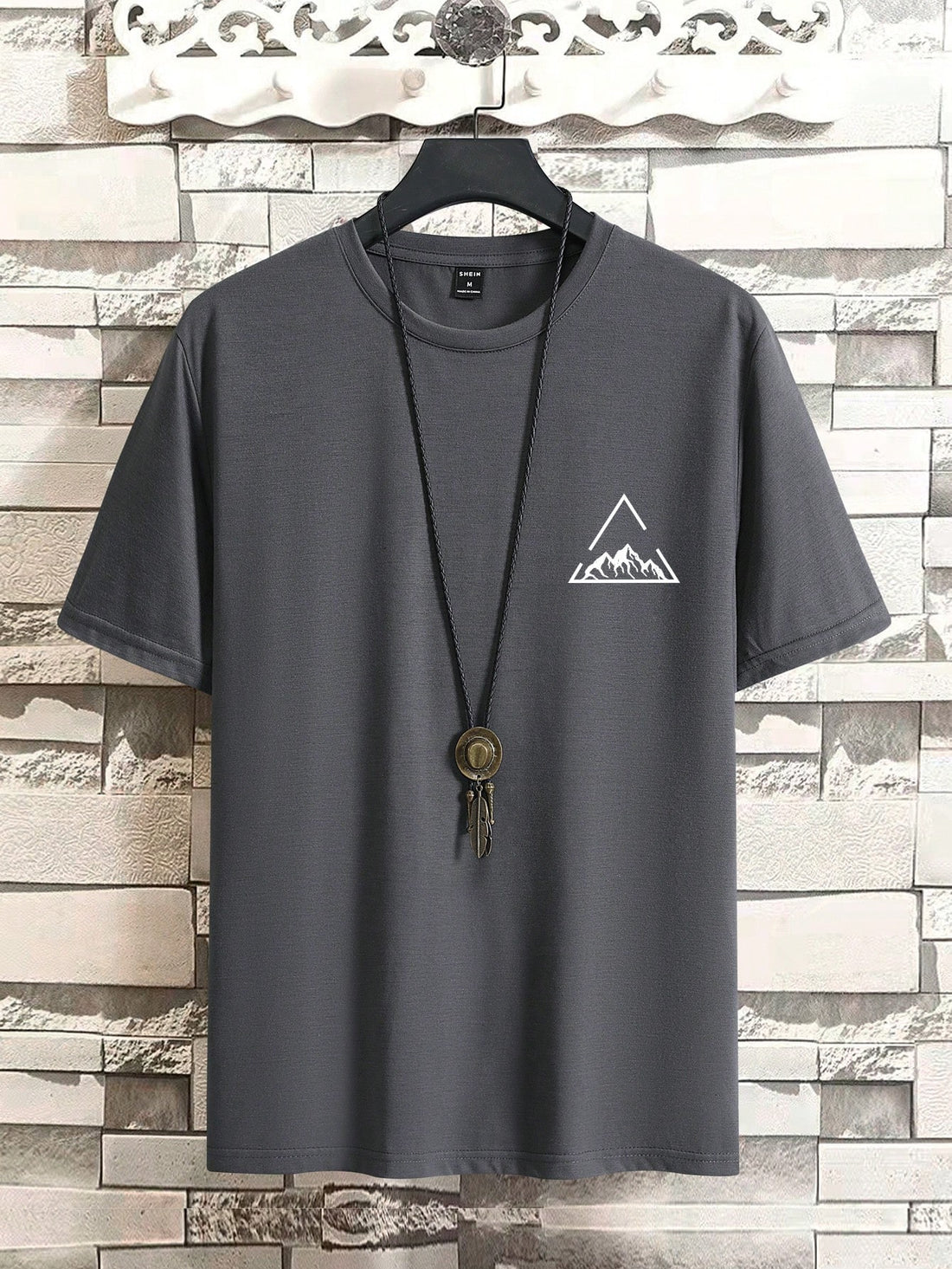 Take on the great outdoors in style with our Men's Summer Mountain Print Graphic Tee! Featuring a cool and casual round neck design and short sleeves, this shirt is perfect for any summer adventure. The unique mountain print adds a touch of personality to your wardrobe. Get ready to climb mountains (or just your daily errands) with this fun and comfortable tee!