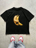 Embrace the nostalgic Y2K vibe with our Anthropomorphic Banana Print T-Shirt! This playful tee features a quirky banana character that adds personality to your street style. Made for comfort with a trendy fit, it's perfect for casual outings, festivals, or making a statement on social media. Pair with baggy jeans and chunky sneakers for the ultimate throwback look!