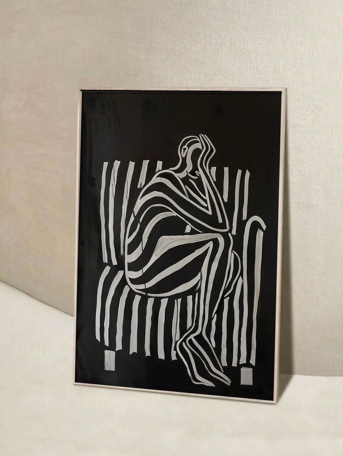 Elevate your space with this playful yet sophisticated black and white abstract human figure canvas. This minimalist art poster adds a dash of personality to any room without shouting for attention. Perfect for those who appreciate art that makes you smile while still looking totally put-together. Your walls have been waiting for this conversation starter!