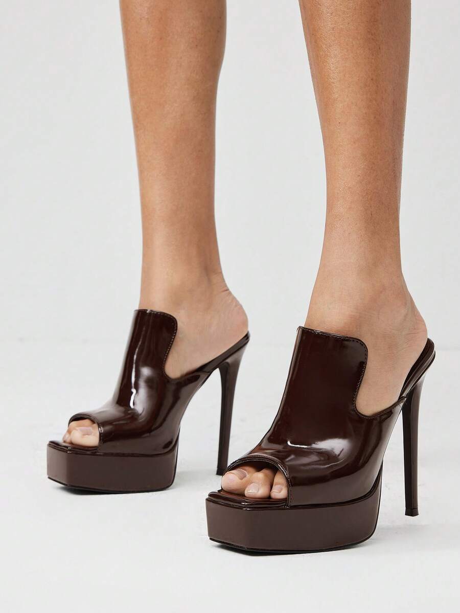 Make a bold statement with these Minimalist Ultra High Heel Sandals for Women, designed for women who love sleek, modern fashion with an elegant edge. Featuring a clean slip-on silhouette and striking ultra-high heels, these sandals create a sophisticated, leg-lengthening look that complements everything from cocktail dresses to tailored jumpsuits and evening gowns.
