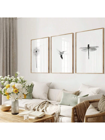 Add a touch of whimsy and style to your space with this set of three modern minimalist prints featuring a dandelion, hummingbird, and dragonfly. Their sleek black and white design fits effortlessly in any home or office, bringing a playful yet elegant vibe. Perfect for brightening walls with subtle nature-inspired charm while keeping things clean and contemporary.