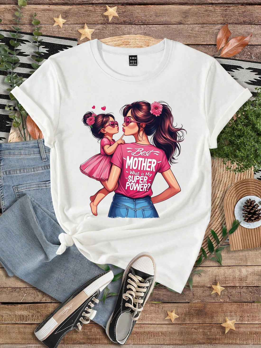 Match your mini-me in style with our Mom & Me Floral Slogan Tee! This trendy tee is perfect for stylish mothers and daughters. Express your bond through fashion and make a statement with our fun and playful slogan design. Get yours today and slay in sync!