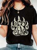 Show off your momma bear pride with this playful and stylish paw print graphic tee! Perfect for Mother's Day or any casual day, this comfy top will make a statement and keep you feeling cool and comfortable. Get your paws on one now!