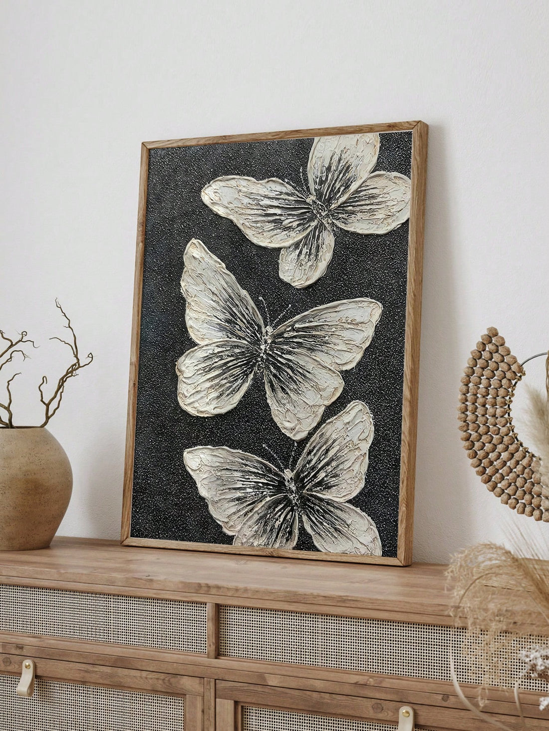 Add a touch of elegance to any space with the Monochrome Butterfly Trio. Each hand-painted piece features delicate butterflies in monochrome colors, adding a sense of sophistication and charm to your home decor. With this wall art decoration, you can effortlessly elevate the style of any room.