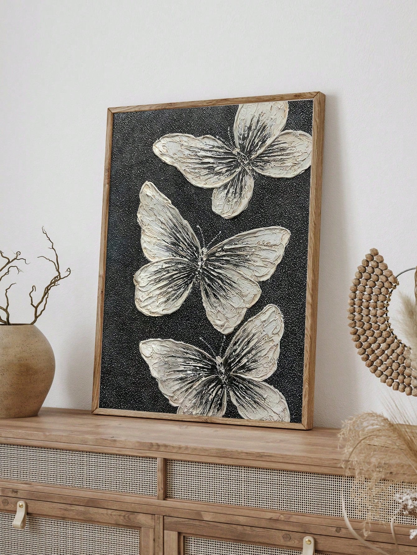 Add a touch of elegance to any space with the Monochrome Butterfly Trio. Each hand-painted piece features delicate butterflies in monochrome colors, adding a sense of sophistication and charm to your home decor. With this wall art decoration, you can effortlessly elevate the style of any room.