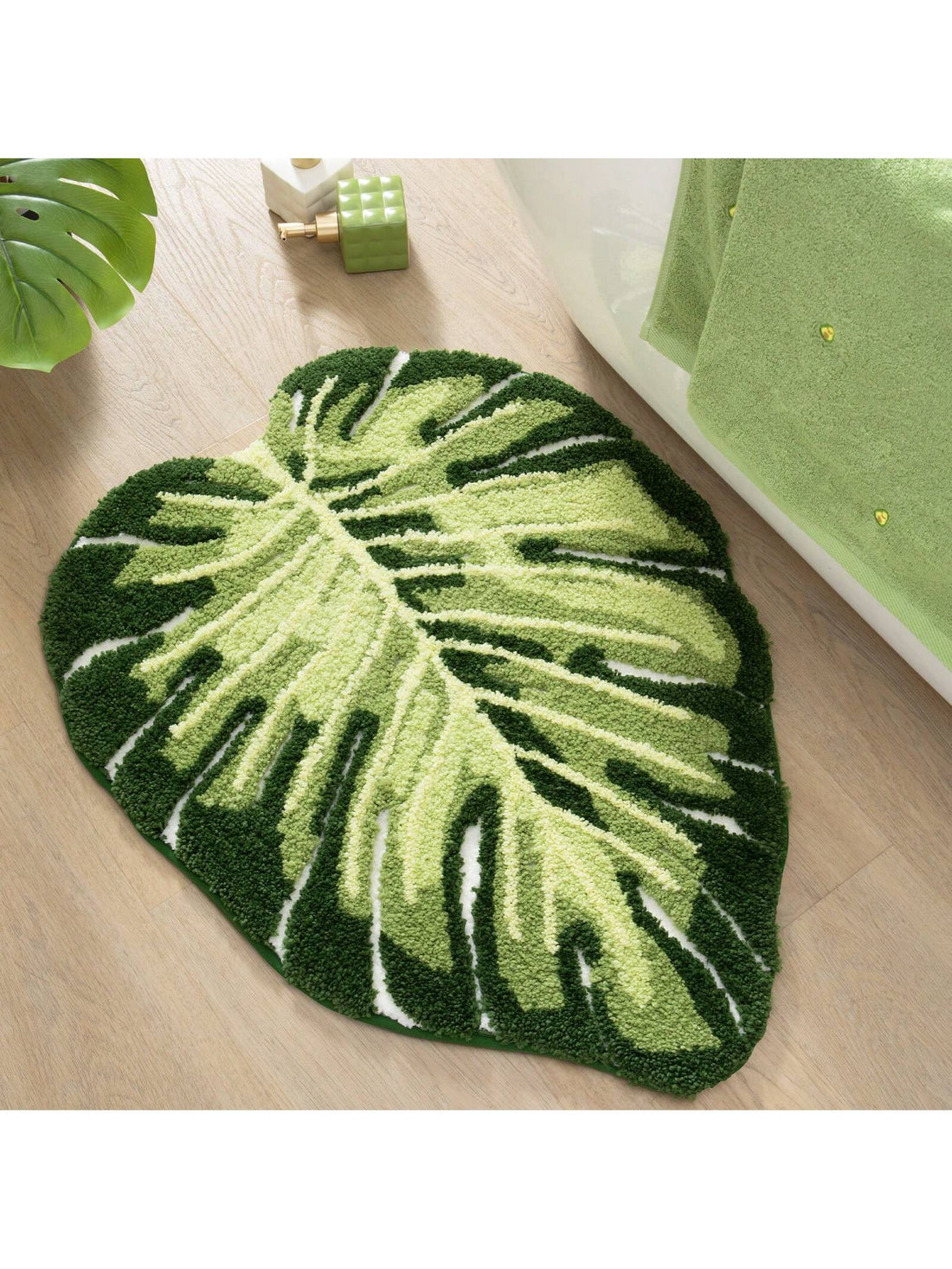 Introducing our Monstera Leaf Shaped Non-Slip Bath Mat - the perfect addition to your bathroom! With its absorbent and washable design, this floor carpet not only looks stylish but also keeps your feet slip-free. Made with high-quality materials, it provides durability and comfort. Upgrade your bathroom experience now!