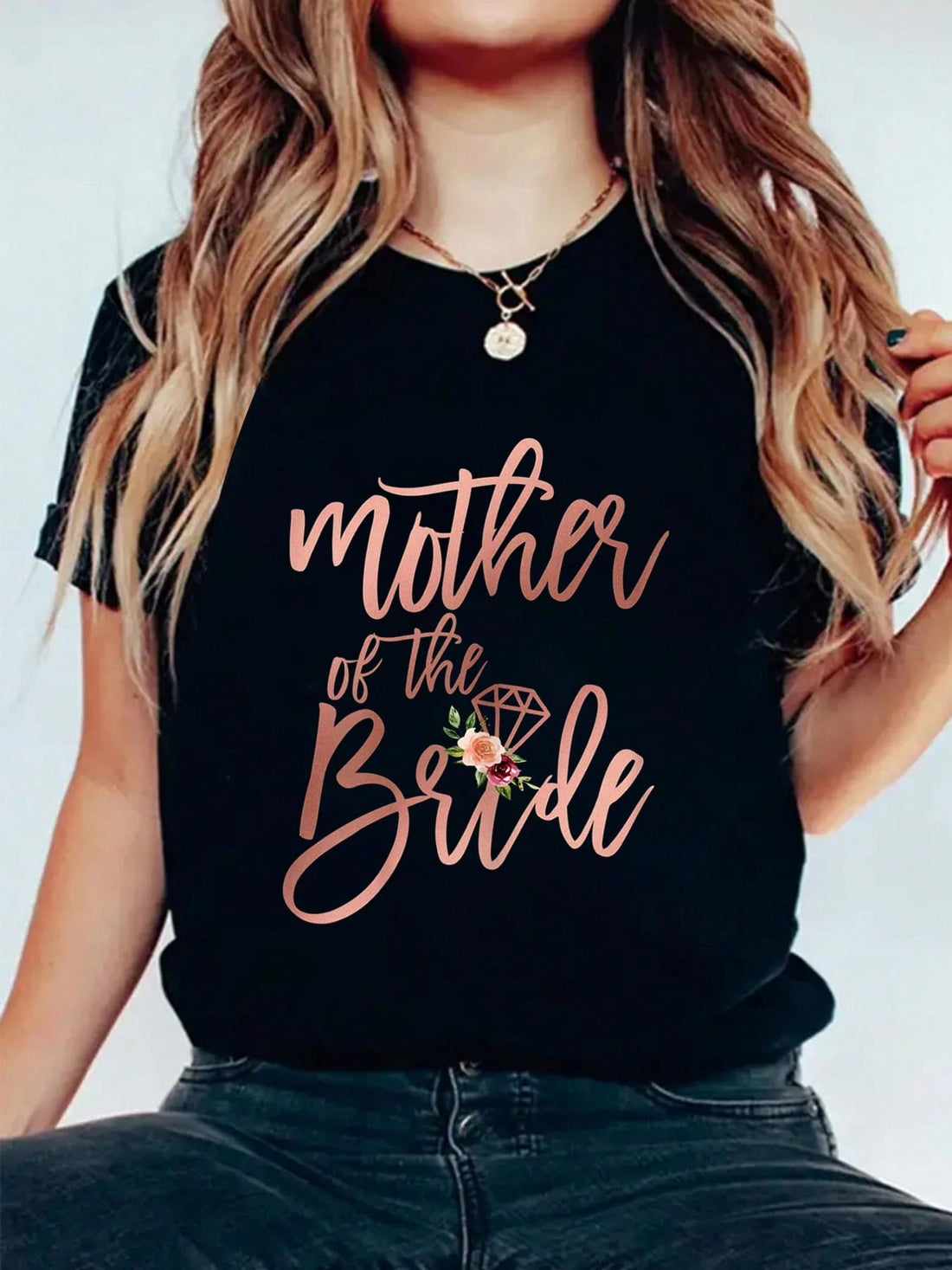 Look stylish and celebrate the special moments with our Mother of the Bride tee! Featuring a trendy short sleeve design, this top is perfect for any mother of the bride. Whether worn during wedding planning or on the big day, this tee adds a touch of fun to any occasion. Order now!