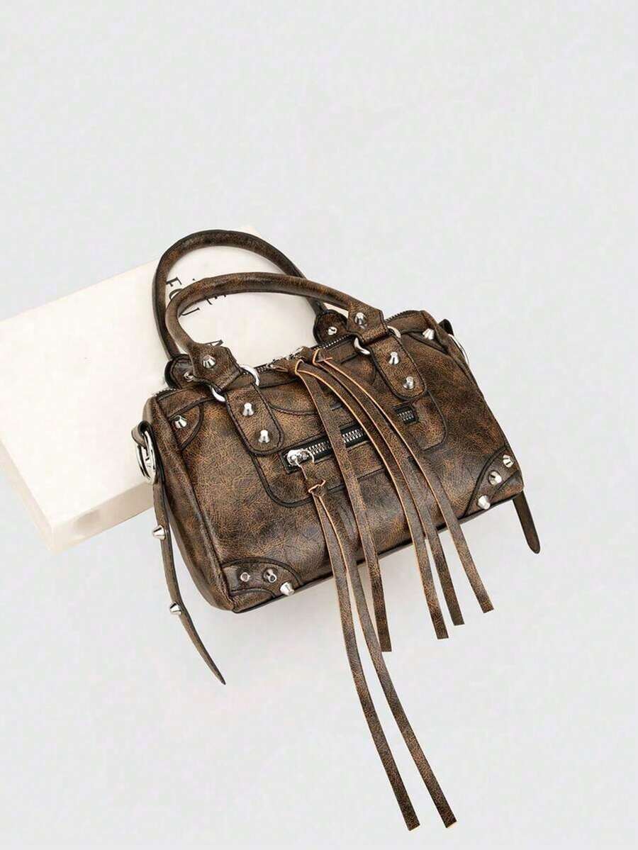 Sleek motorcycle-inspired crossbody bag designed for the modern woman on the move. Features a structured silhouette with adjustable shoulder strap for versatile wear—wear it crossbody for hands-free convenience or over your shoulder for classic style. Durable construction with multiple compartments keeps essentials organized. Perfect for daily commutes, weekend outings, or travel. Compact yet spacious, this fashion-forward bag combines edgy aesthetics with practical functionality.