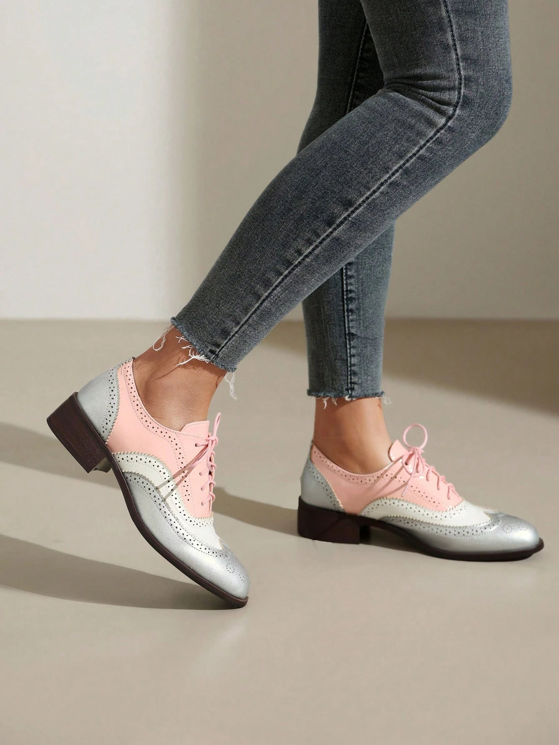 Step out in style with these Multicolor Women's Perforated Lace-Up Wingtip Oxfords. Crafted from vintage leather, their charming wingtip design and perforated details add a touch of retro flair. The comfortable flat sole makes them perfect for all-day adventures, while the vibrant colors bring a playful twist to a classic look. Mix vintage vibes with modern fun in these unique shoes!
