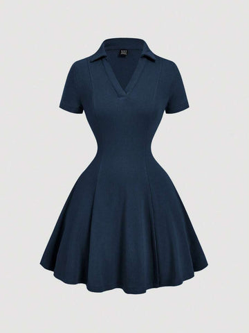 Front view of navy blue rib-knit polo mini dress with flared A-line hem