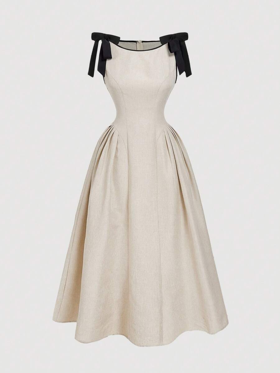 Slip into timeless elegance with this navy blue sleeveless dress that's anything but boring. Crisp contrast trim frames the neckline and armholes, while a charming bow detail adds a touch of personality. The flared hem swings with every step, creating a flattering silhouette that works from brunch to evening plans. Perfect for those days when you want to look put-together without trying too hard. A wardrobe essential that proves simple can be seriously stylish.