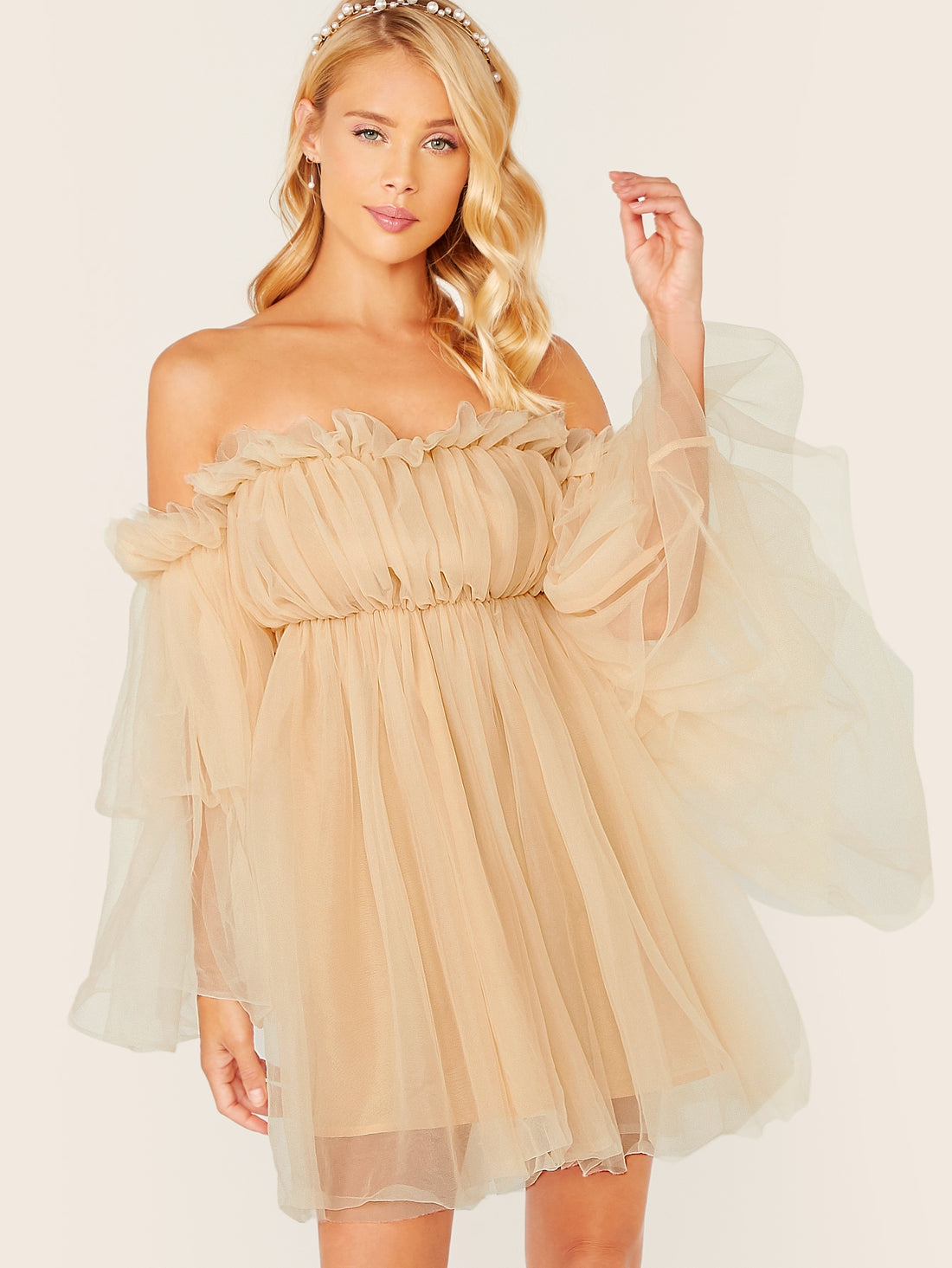 Be effortlessly elegant for any occasion with this Off-Shoulder Ruffle Mesh Dress. The unique design showcases your shoulders while the flowing ruffles add a touch of playfulness. Perfect for any event, this dress will have you looking and feeling confident. Why blend in when you can stand out with this dress?