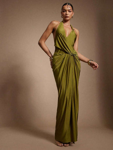 Slip into effortless elegance with this olive green satin halter dress—your new go-to for summer soirées and nights out. The luxe satin fabric drapes beautifully while the halter neckline offers a flattering, sophisticated silhouette. The flowing long length keeps things classy and comfortable, whether you're heading to dinner, a rooftop party, or a special occasion. Pair it with strappy heels and minimal jewelry to let this stunning piece steal the show. Because sometimes the best nights start with the per