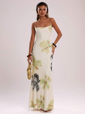 Elevate your warm-weather wardrobe with this stunning ombre gradient cami dress. Featuring a flattering backless design with criss-cross lace-up detailing and delicate spaghetti straps, this maxi dress combines elegance with effortless style. The all-over botanical print and slim-fit silhouette create a graceful mermaid hem that flows beautifully. Crafted from a high-stretch knit blend of polyester and elastane, it offers comfort and flexibility for all-day wear. Perfect for beach getaways, casual outings, 