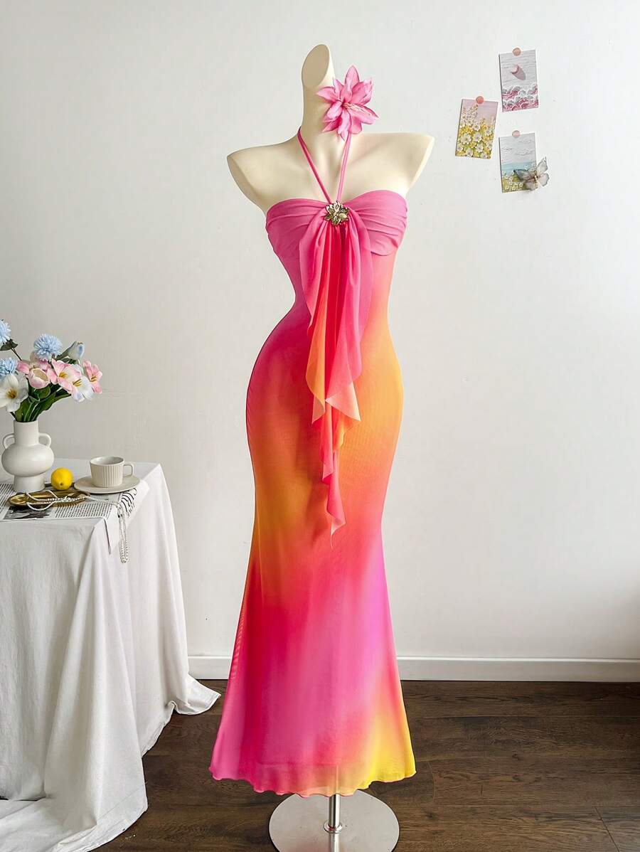 Elevate your summer wardrobe with this stunning ombre halter neck fit and flare dress. The flattering silhouette hugs your curves before flowing gracefully from the waist, creating an effortlessly elegant look. The halter neckline adds a touch of sophistication while the ombre gradient brings visual interest and depth.