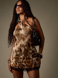 Turn heads in this playful one-shoulder mini dress featuring a bold animal print and delicate lace trim. Perfect for evening parties, its sleek silhouette combines wild style with a touch of elegance, making it your go-to for unforgettable nights out.