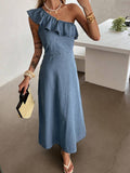 Front three-quarter view of washed-blue one-shoulder ruffle denim maxi dress with fitted waist