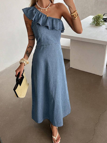 Front three-quarter view of washed-blue one-shoulder ruffle denim maxi dress with fitted waist