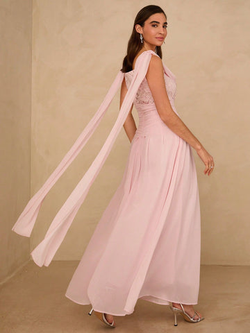 This pastel pink maxi dress showcases refined lace patchwork construction, delivering understated sophistication for spring and summer occasions. The carefully curated color palette and intricate lace detailing create a polished aesthetic suitable for date nights, holiday gatherings, and special events. The maxi silhouette offers graceful proportions and comfortable wear throughout the day. Crafted with attention to detail, this piece serves as a versatile foundation for a curated wardrobe, pairing effortle