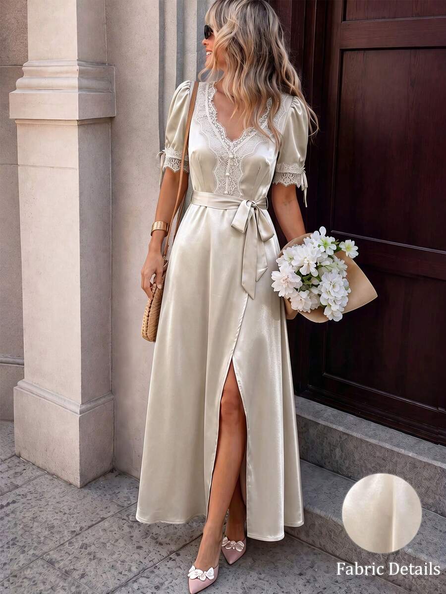 Front three-quarter view of champagne lace satin maxi dress with V neck and thigh slit