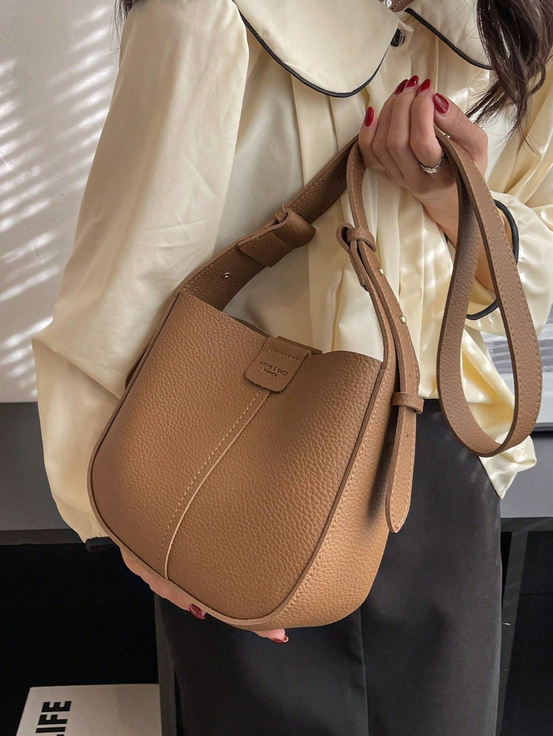 This Patchwork Perfection bag is versatile and stylish with its convertible crossbody design and inner pouch. Perfect for on-the-go fashion, it offers easy organization and hands-free convenience. Made with high-quality materials, it is durable and functional for everyday use. Experience patchwork perfection today.