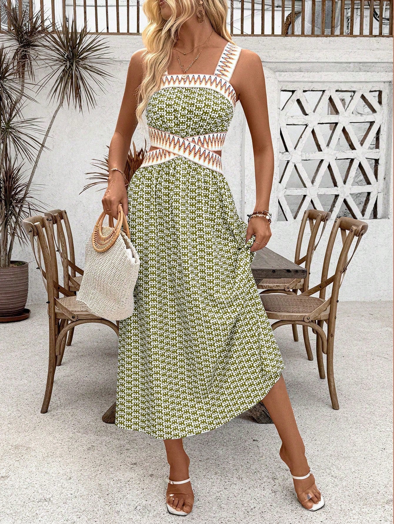 Expertly crafted with a patchwork printed design and a woven belt, this holiday dress exudes elegance. The unique hollow out sleeveless design adds a touch of sophistication, while providing a flattering silhouette. Perfect for any holiday event, this dress is sure to make a statement.