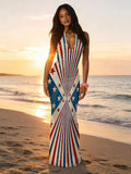 Front view of patriotic deep V halter maxi dress with red blue stars and stripe graphics