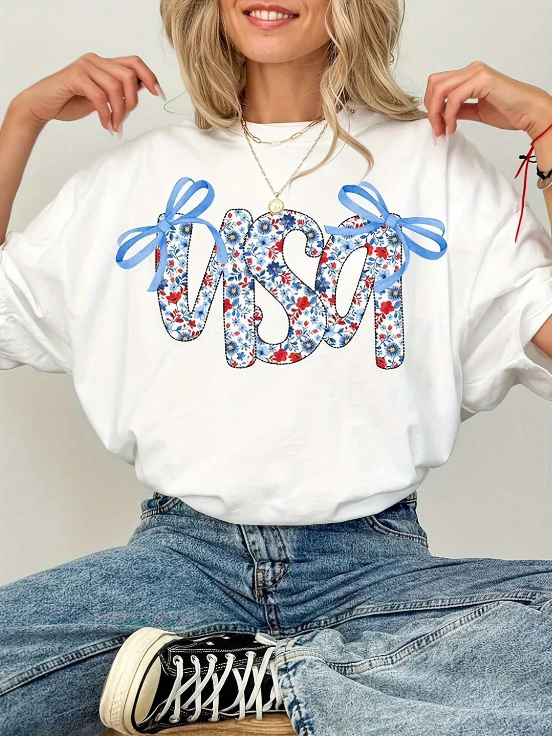 Celebrate your American spirit in style with this playful Patriotic USA Flag Bowknot T-Shirt for Women. Featuring a charming bowknot and a vibrant stars and stripes design, this summer top combines comfort and flair. Perfect for sunny days and festive occasions, it adds a fun, patriotic touch to your wardrobe while keeping you cool and confident.