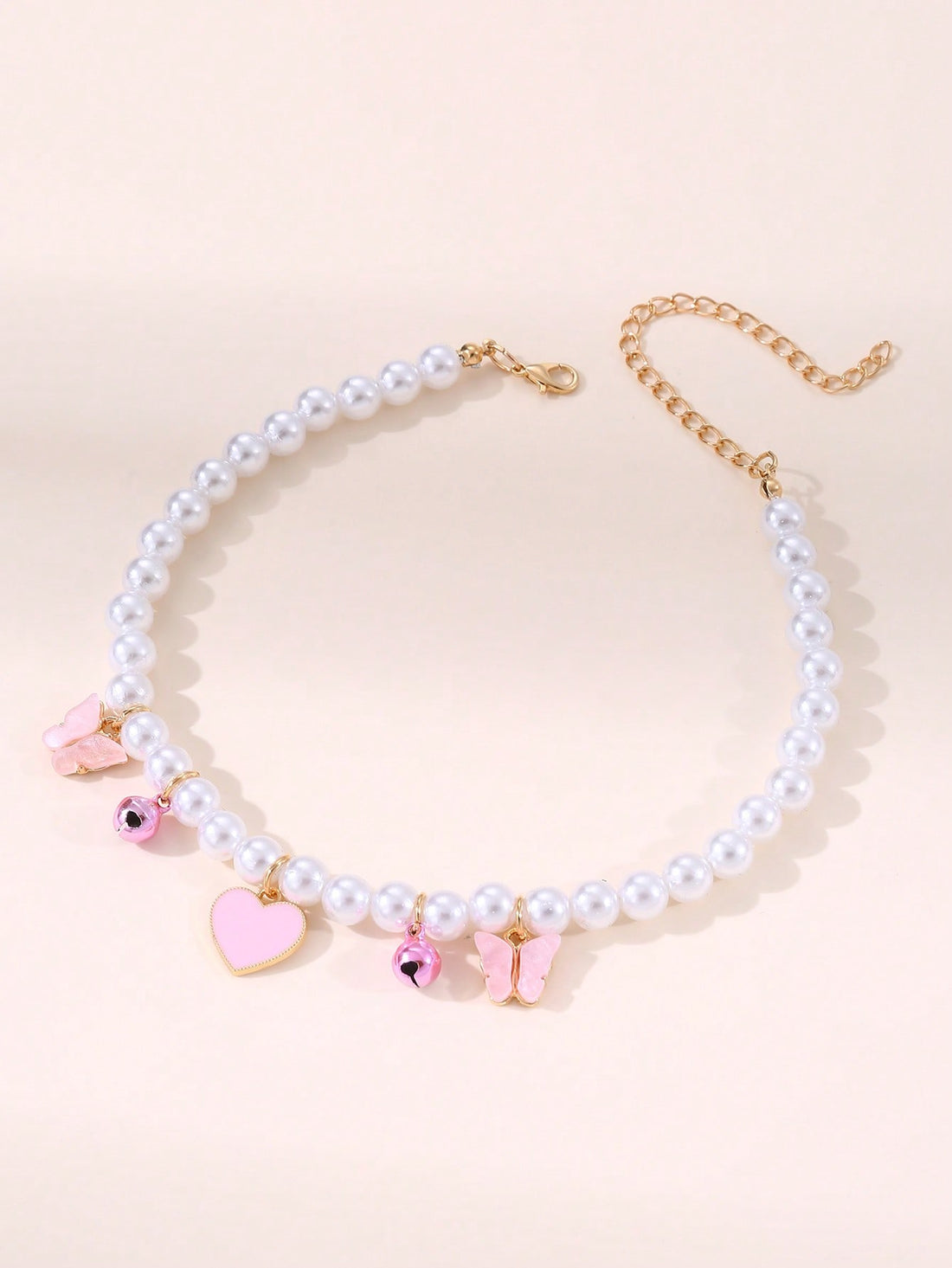 Elevate your pet's style with our Pet Jewelry: Heart Butterfly Pendant Pearl Necklace. This stunning accessory is perfect for small to medium sized pets and features a beautiful heart pendant adorned with a delicate butterfly and shimmering pearls. 