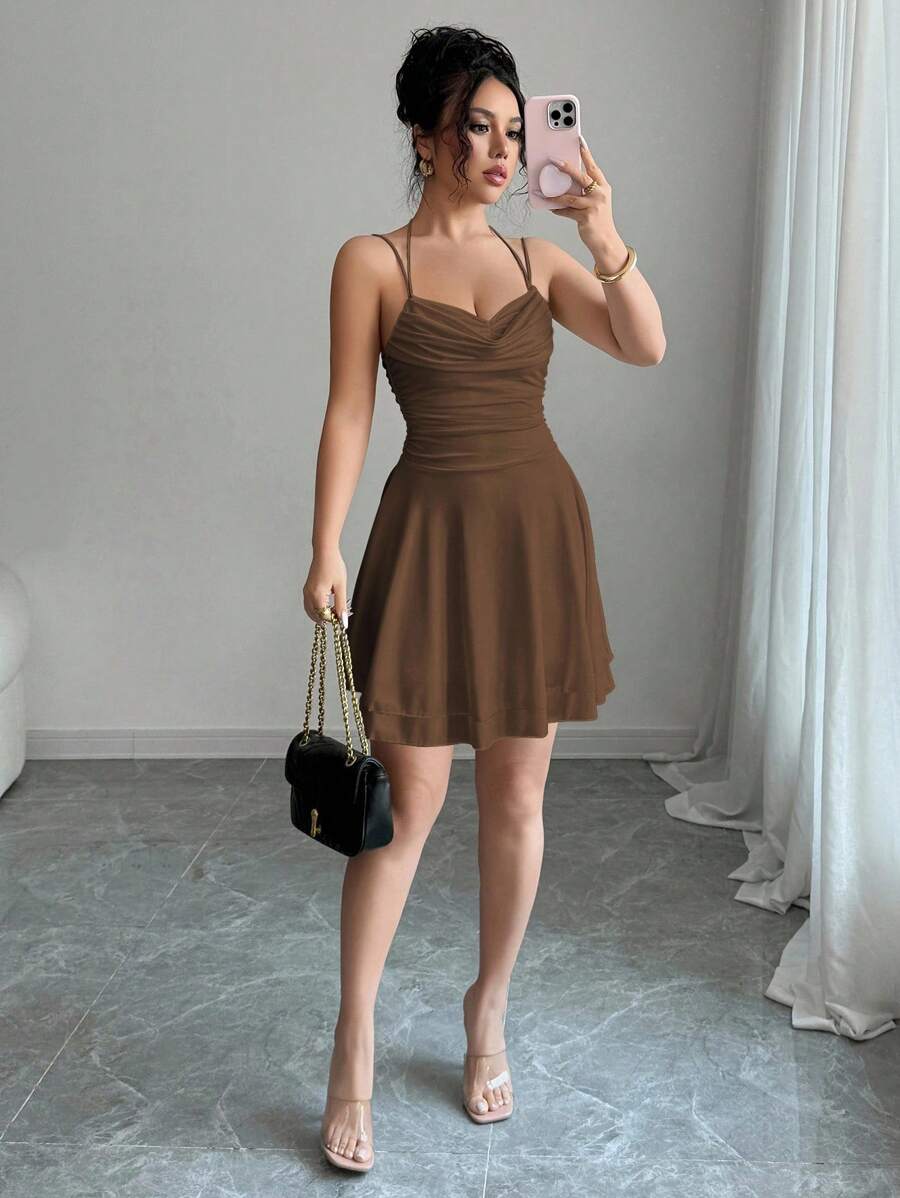 Turn heads and feel fabulous in this playful pink backless ruched mini dress. Its flirty silhouette and gathered detailing add just the right amount of sass, making it your go-to for birthdays, concerts, and warm summer nights. Effortlessly cool and irresistibly chic, this dress brings fun and confidence to every occasion.