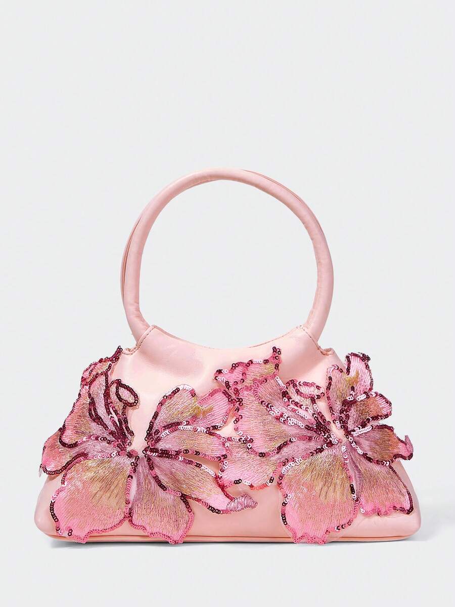 Add a feminine statement to your wardrobe with this pink floral top handle bag for women. Beautifully crafted with shimmering sequin floral details and premium faux leather, this elegant handbag combines eye-catching design with everyday functionality, making it a perfect accessory for both special occasions and daily wear.