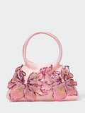 Add a feminine statement to your wardrobe with this pink floral top handle bag for women. Beautifully crafted with shimmering sequin floral details and premium faux leather, this elegant handbag combines eye-catching design with everyday functionality, making it a perfect accessory for both special occasions and daily wear.
