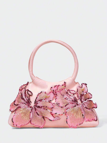 Add a feminine statement to your wardrobe with this pink floral top handle bag for women. Beautifully crafted with shimmering sequin floral details and premium faux leather, this elegant handbag combines eye-catching design with everyday functionality, making it a perfect accessory for both special occasions and daily wear.