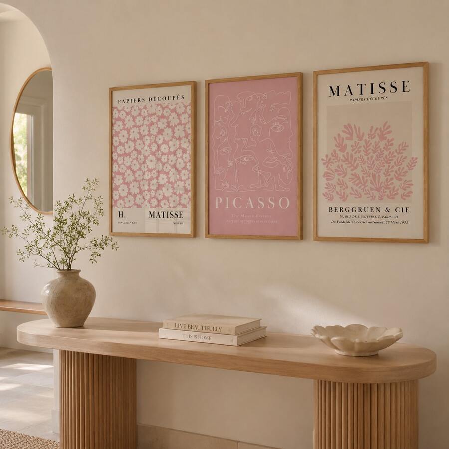 Three-piece pink Matisse and Picasso canvas art set above a warm entry console