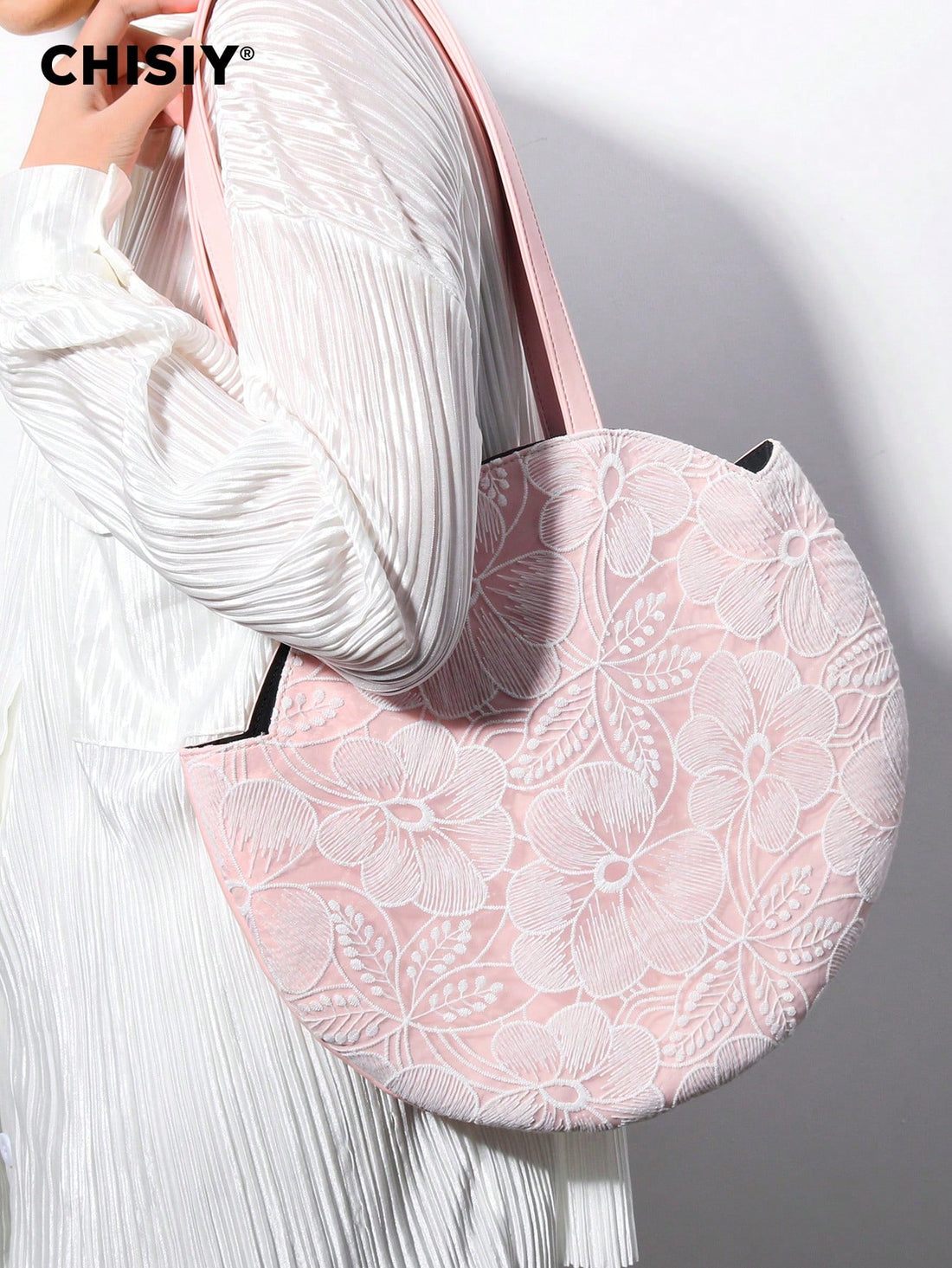 This Pink Provence Lace Circular Bag is perfect for the stylish and professional woman on-the-go. With its elegant lace design and circular shape, it's both fashionable and functional. Use it as a versatile business commuter bag for all your daily essentials.