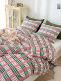 Upgrade your bedroom with our Pink and Green Geometric Plaid Bedding Set. Made with soft washed polyester fabric, this set is both comfortable and durable. The striking color combination adds a stylish touch to any bedroom decor. Experience the best of comfort and style with our bedding set.