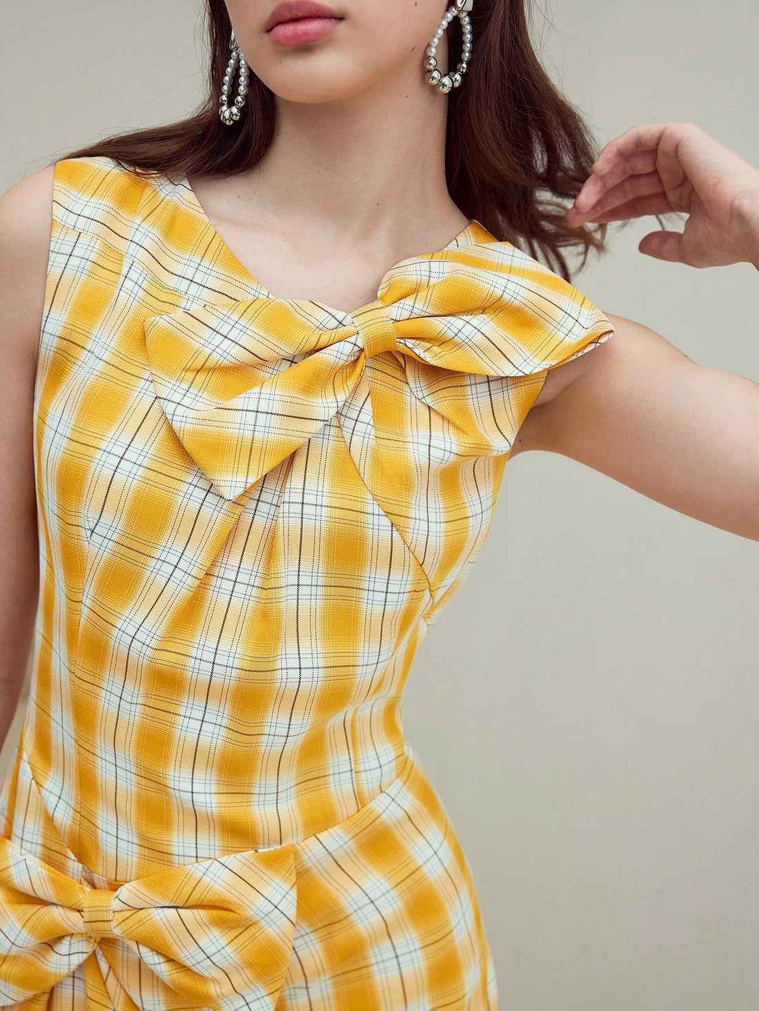 Step out in style with this playful plaid dress featuring a charming bow detail. Perfect for any occasion, it blends classic patterns with a fun twist, making your outfit effortlessly chic. Whether you're headed to brunch or a casual party, this dress adds a dash of personality and flair to your wardrobe.