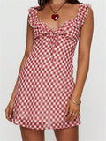Unleash your playful side in this plaid mini dress! With its ruffled details and tie-up front, you'll be sure to turn heads. The sleeveless V-neck design is perfect for summer fashion, making it an essential addition to your wardrobe. Stand out from the crowd with this unique and stylish dress.